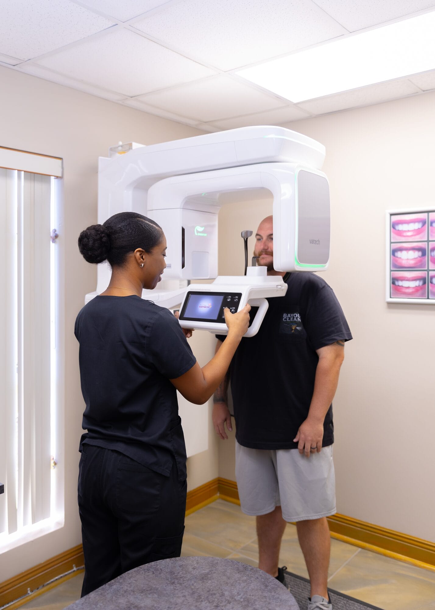 A Barataria Dental hygienist positioning a patient for a panoramic digital x-ray
